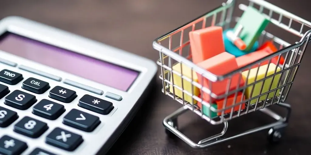 Calculator and shopping cart representing e-commerce pricing.
